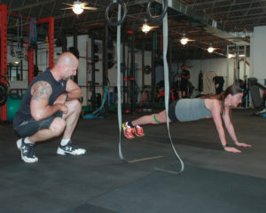 Woman Planking with Tony Personal Trainer